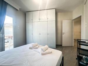 Postel nebo postele na pokoji v ubytování G&G Seaside Apartment