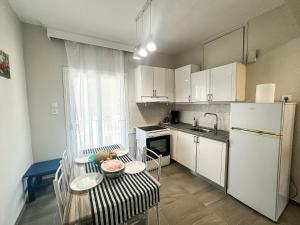 Kuchyň nebo kuchyňský kout v ubytování G&G Seaside Apartment