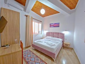 Postel nebo postele na pokoji v ubytování Enma Rooms