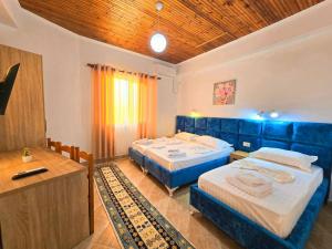 Postel nebo postele na pokoji v ubytování Enma Rooms