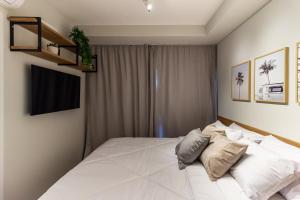 Cama ou camas em um quarto em 360 Ambience Vila Mariana