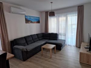a living room with a couch and a table at Villa Toni II in Biograd na Moru