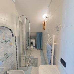 a bathroom with a shower and a toilet at Casa Maria - Furore Amalfi Coast in Furore