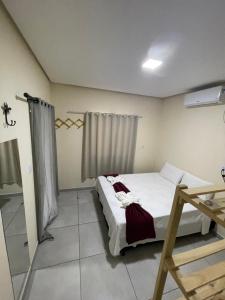 Cama ou camas em um quarto em Pousada Vista da Serra - Suzart