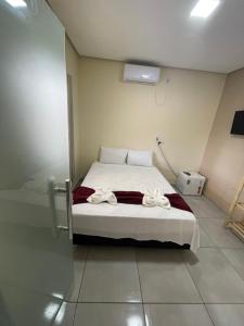 Cama ou camas em um quarto em Pousada Vista da Serra - Suzart