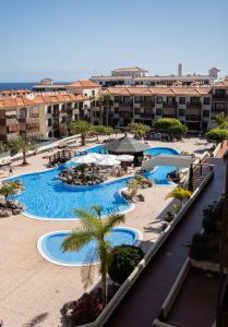 an overhead view of a resort with several pools at Appartment Zomero, SEAVIEW & WIFI & POOL in Costa Del Silencio
