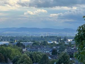 a cityscape of a town with mountains in the distance at Wohnung mit schönem Aussicht in Bendorf