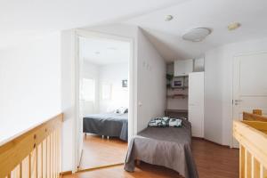 Postel nebo postele na pokoji v ubytování Spacious alpine flat in center of Levi!