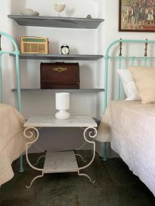 A bed or beds in a room at Galatea House Katoï with patio
