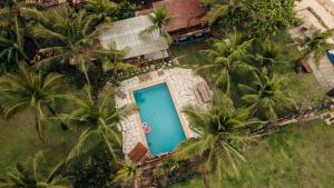 an aerial view of a villa with palm trees at Villa Iamani in Arraial d'Ajuda