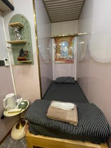 Postel nebo postele na pokoji v ubytování 榆迪賓館 YUTIK Guesthouse