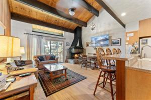 a kitchen and living room with a table and chairs at Corwin's Quarters in Kings Beach