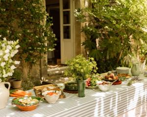 a table with vegetables and other foods on it at Le Clos de Gordes in Gordes +44 photos