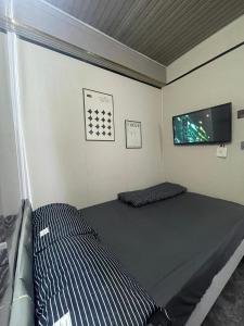 Postel nebo postele na pokoji v ubytování 榆迪賓館 YUTIK Guesthouse