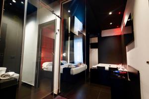 Maximum hub suite&spa tesisinde bir odada yatak veya yataklar