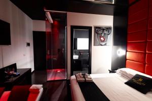 Maximum hub suite&spa tesisinde bir odada yatak veya yataklar