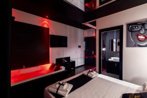 Maximum hub suite&spa tesisinde bir odada yatak veya yataklar