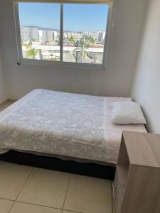 Ένα ή περισσότερα κρεβάτια σε δωμάτιο στο bonito departamento en yecapixtla con alberca