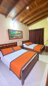 Letto o letti in una camera di Hotel Tequendama