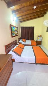 Letto o letti in una camera di Hotel Tequendama