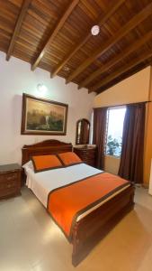 Postel nebo postele na pokoji v ubytování Hotel Tequendama