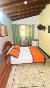 Letto o letti in una camera di Hotel Tequendama