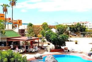 a view of a resort with a swimming pool at Apartamento Vacacional Isabella in San Miguel de Abona