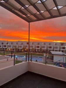 a view of a pool from the balcony of a apartment at Casa Cordova in Alpuyeca