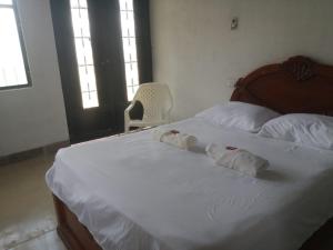 Hostal La Cabaña客房内的一张或多张床位