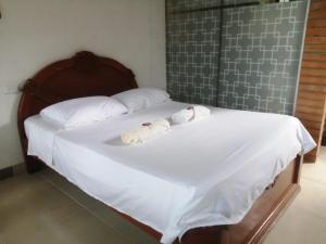 Hostal La Cabaña客房内的一张或多张床位