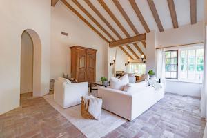 a living room with two white couches at Idyllic Casita on Private Fairbanks Ranch Estate in Rancho Santa Fe