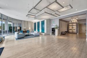 a large living room with couches and a table at Ocean View Hotel in Los Angeles