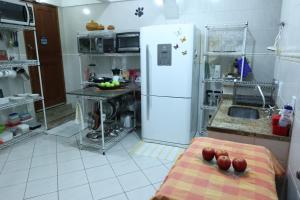 Nhà bếp/bếp nhỏ tại Recreio - CorAll Experience - 2 Quartos e 1 Suíte