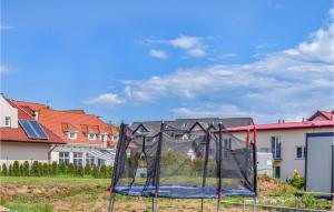 a basketball hoop in front of some houses at 2 Bedroom Pet Friendly Home In Rewal in Rewal +22 photos