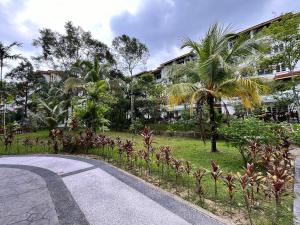 an empty road in front of a building at Seruni Apartment - 3 Bedrooms in Serendah