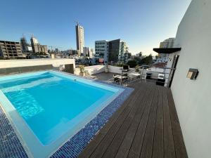 a swimming pool on the roof of a building at Mazatlán Cervo vacacional in Mazatlán
