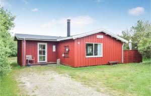 a red house with a red at Alsbo in Sønderho