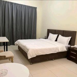 Ένα ή περισσότερα κρεβάτια σε δωμάτιο στο Shaikh Vacation Homes