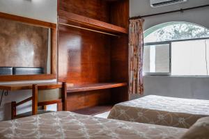 Postel nebo postele na pokoji v ubytování Hotel María de la Luz