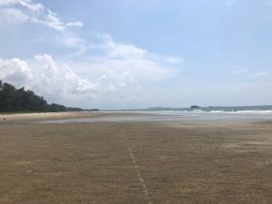 an empty beach with a line in the sand at Samsuria Beach Apartment Resort in Kuantan