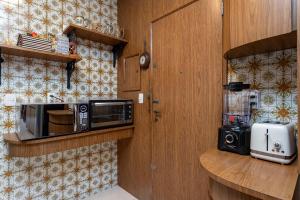 Кухня или мини-кухня в Apartamento vista mar e vista pão de açúcar
