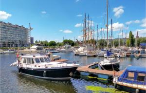 a group of boats docked in a harbor at 1 Bedroom Lovely Apartment In Oostende in Ostend