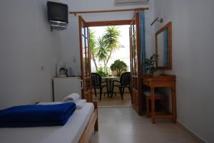 Postel nebo postele na pokoji v ubytování Flisvos Rooms