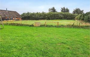 a field of grass with a soccer goal in it at Four-Bedroom Holiday Home In Ulfborg in Øhuse
