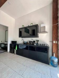 a living room with a tv on the wall at Casa Santiago - Zona Exclusiva in Guanajuato