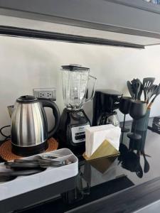 a kitchen counter with a blender and other kitchen utensils at Casa Santiago - Zona Exclusiva in Guanajuato