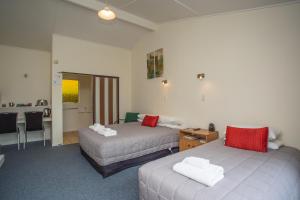 Postel nebo postele na pokoji v ubytování The Coast Motel
