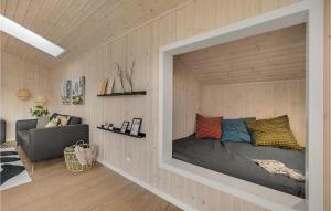 a bedroom with a bed in a wall at 5 Bedroom Amazing Home In Glesborg in Glesborg