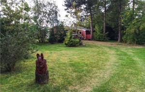 a statue of a dog in a yard at Holiday Home Strandholmen Millinge V in Millinge