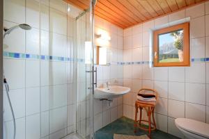 a bathroom with a sink and a shower and a toilet at Haus Jasmin in Ellmau